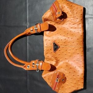 Prada ostrich handbag purchased from thrift store with some damage.